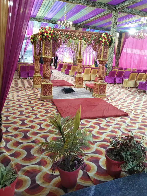 Grand wedding mandap with floral decorations in the Jagan Palace banquet hall