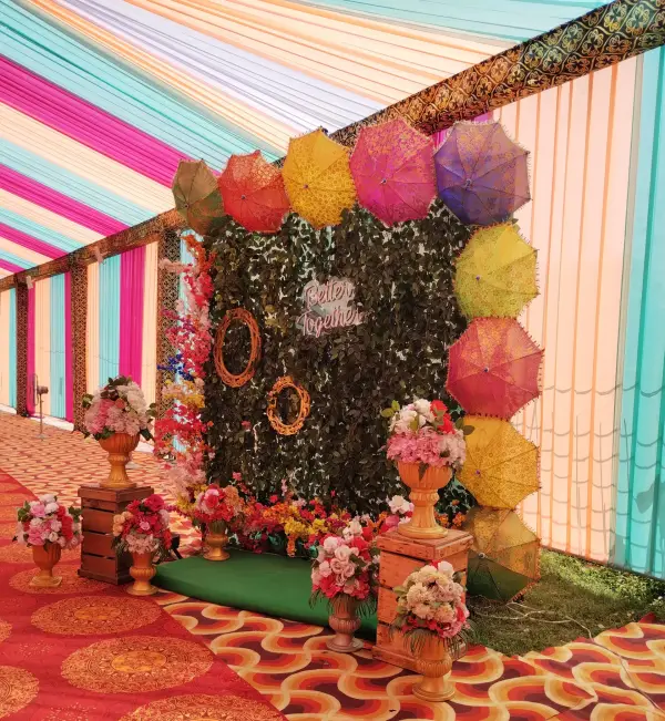 Colourful umbrella photo-booth backdrop at a celebration