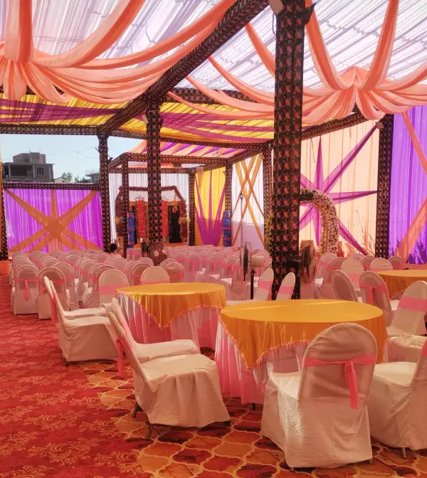 Banquet tent with round tables set for a wedding reception