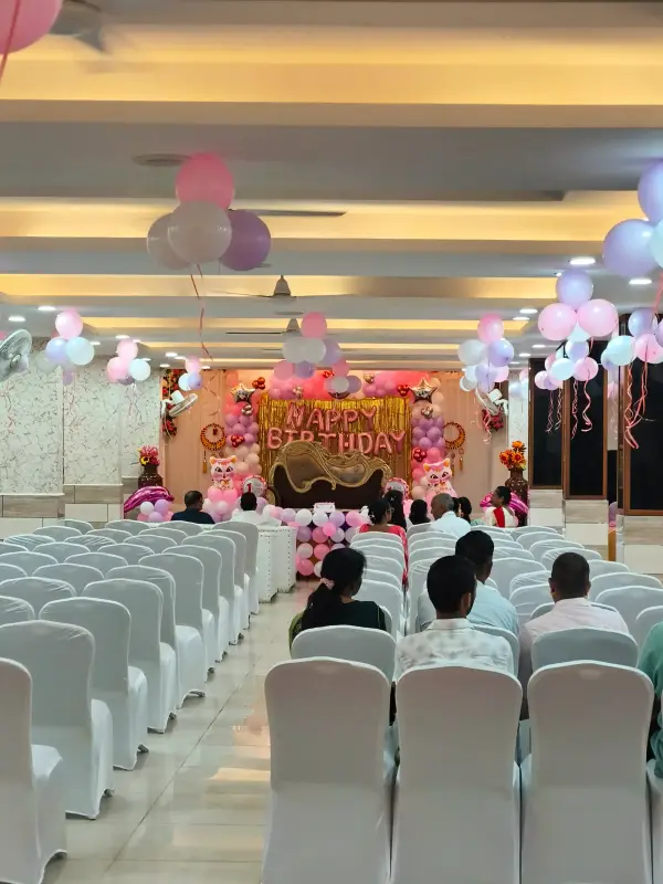 Guests seated in the air-conditioned hall during a birthday function