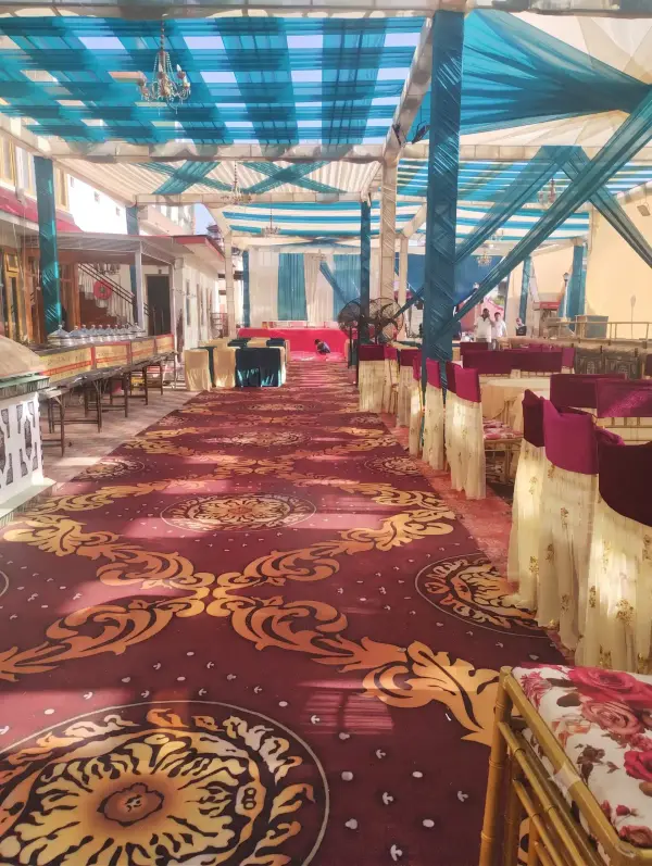 Long banquet dining tent set with tables and chairs