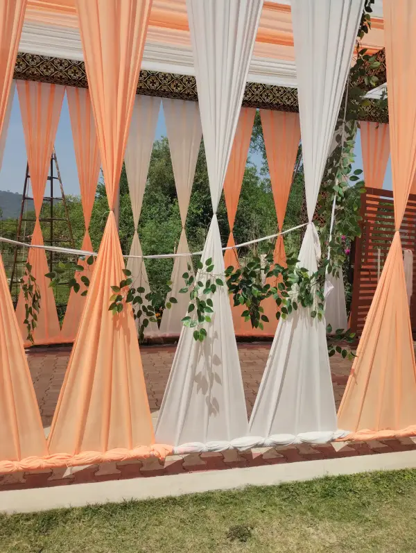 Draped outdoor decor with greenery and open views