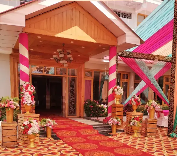Jagan Palace entrance decorated with candy-striped pillars and floral urns